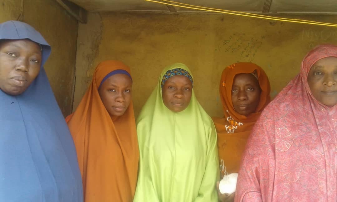 Five women in colourful hijabs standing together, representing the communities Maidabo Foundation serves