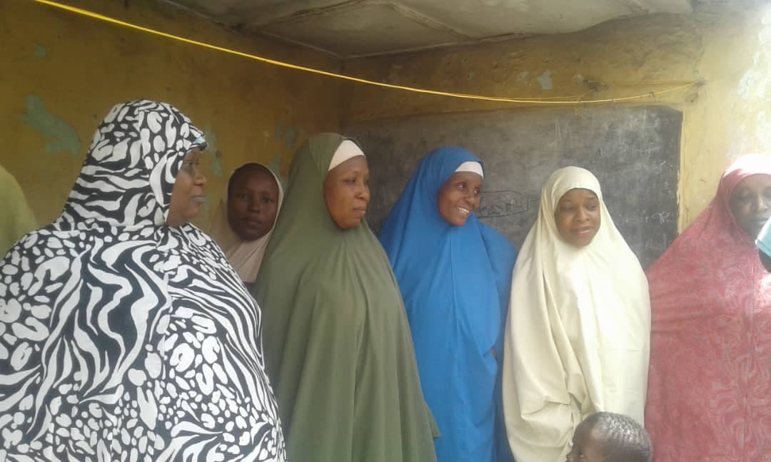 Families and women at a Maidabo Foundation outreach activity