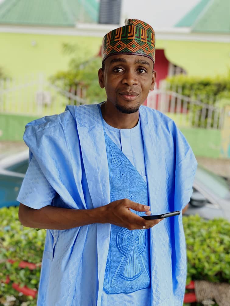 Portrait of Aliyu Isyaku Ibrahim in traditional light-blue attire